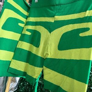 2 piece 2 tone Size M green high waist biker shorts and open side adjustable tie